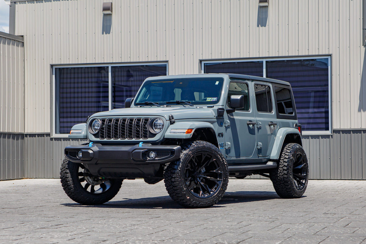 2024 Jeep Wrangler Sport S 4XE with a 2.5" Rough Country lift kit, 22x12 Fuel Flame wheels, and 35" Fury Country Hunter R/T tires.
