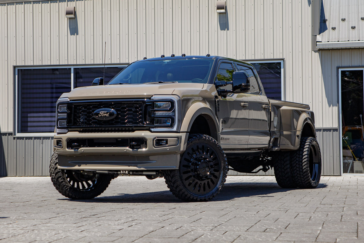 2026 Ford F-450 Super Duty Platinum with a 4" Wicked lift kit, 26x8.25 American Force Massive wheels, and 37" AMP Terrain Attack M/T A tires.