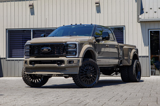 2026 Ford F-450 Super Duty Platinum with a 4" Wicked lift kit, 26x8.25 American Force Massive wheels, and 37" AMP Terrain Attack M/T A tires.