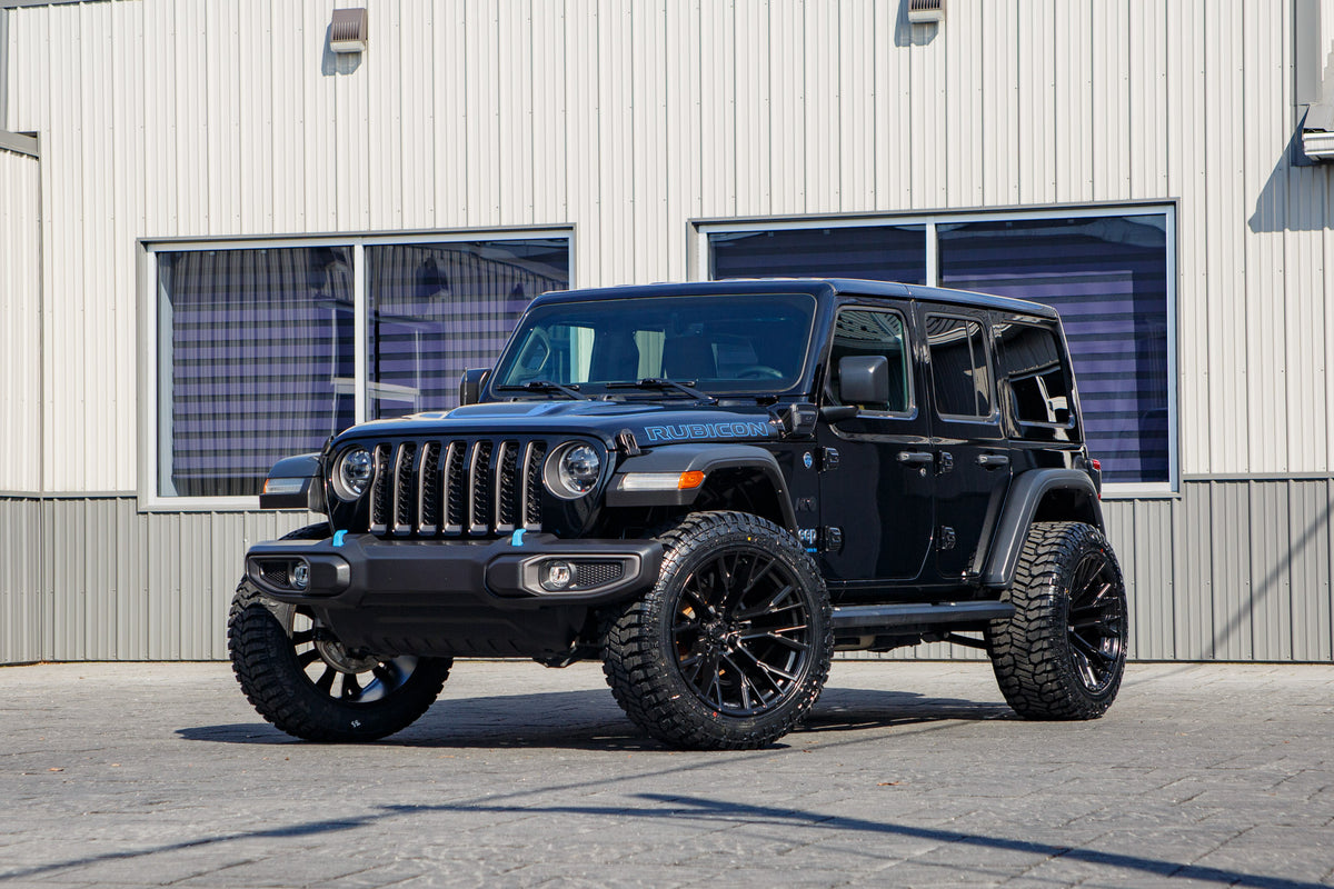 2023 Jeep Wrangler Rubicon 4XE with Jeep Stock suspension, 22x12 Fuel Rebar wheels, and 35" Avix Trailtek R/T tires.