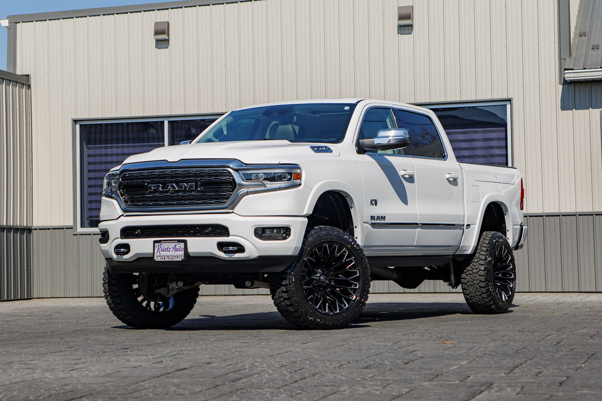 2024 Ram Limited with a 5" Rough Country lift kit, 22x12 Fuel Strike wheels, and 35" Fury Country Hunter R/T tires.