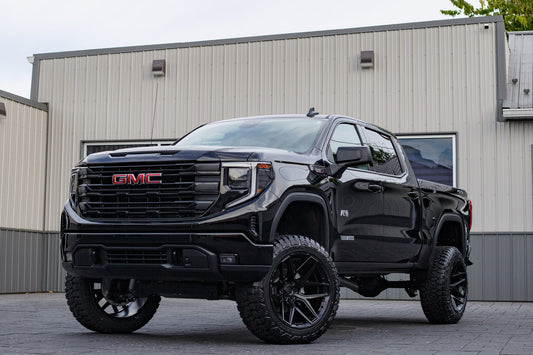 2025 GMC Sierra 1500 AT4 with a 6" Rough Country lift kit, 22x12 Fuel Flux wheels, and 35" Fury Country Hunter R/T tires.