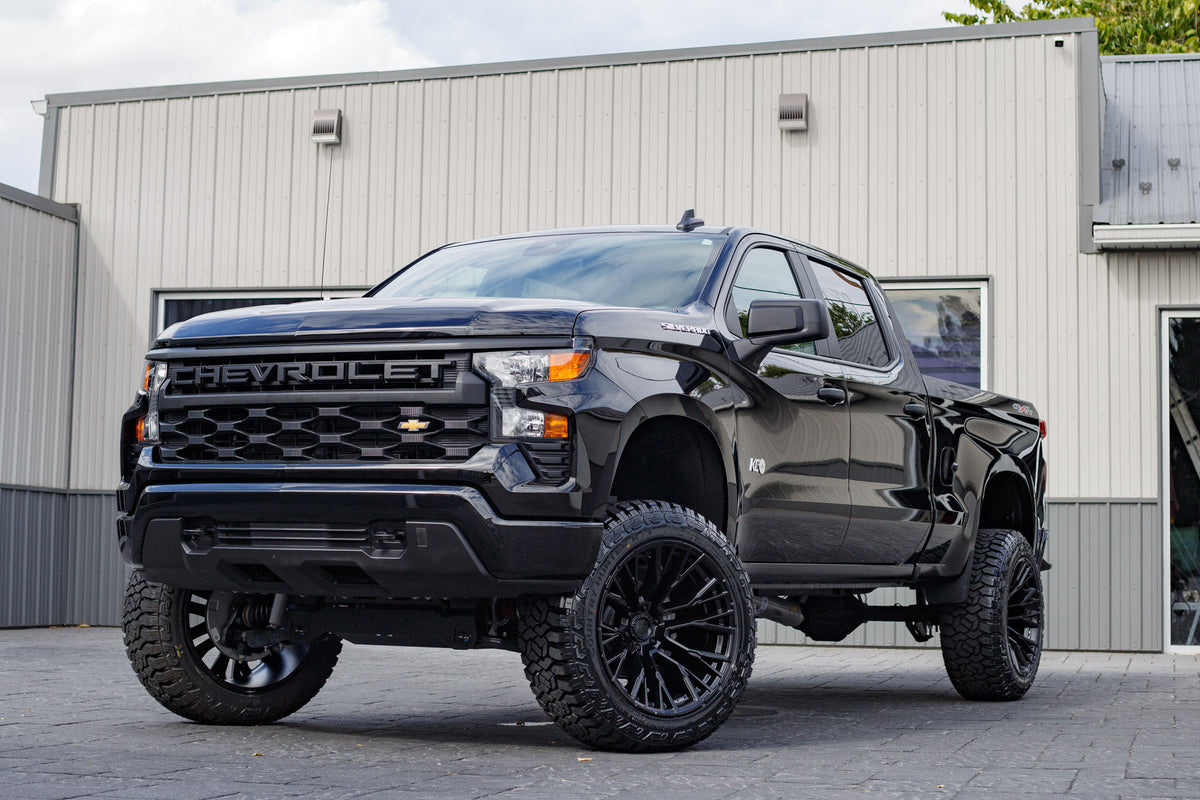 2024 Chevrolet Silverado 1500 Custom with a 6" Rough Country lift kit, 22x12 Fuel Rebar wheels, and 35" Fury Country Hunter R/T tires.