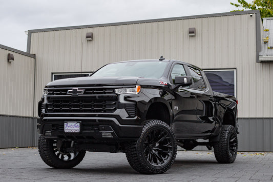 2023 Chevrolet Silverado 1500 RST with a 6" Rough Country lift kit, 22x12 Fuel Flame wheels, and 35" Avix Trailtek R/T tires.