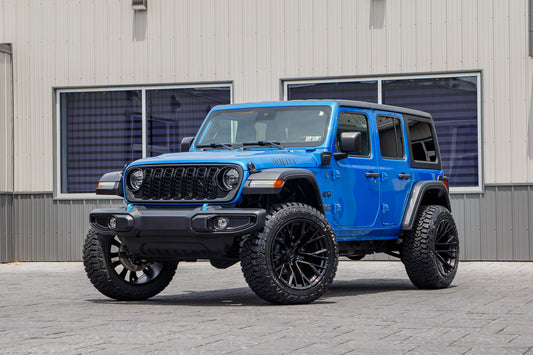 2024 Jeep Wrangler Willys 4XE with a 2.5" Rough Country lift kit, 22x12 Fuel Rebar wheels, and 35" Fury Country Hunter R/T tires.