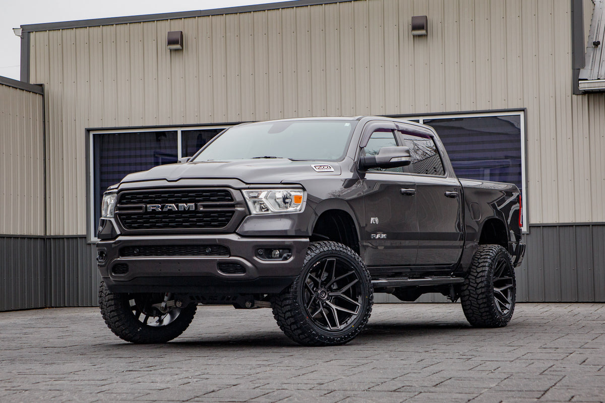 2022 Ram 1500 Big Horn with a 6" Rough Country lift kit, 22x12 Fuel Flux wheels, and 35" Avix Trailtek R/T tires.