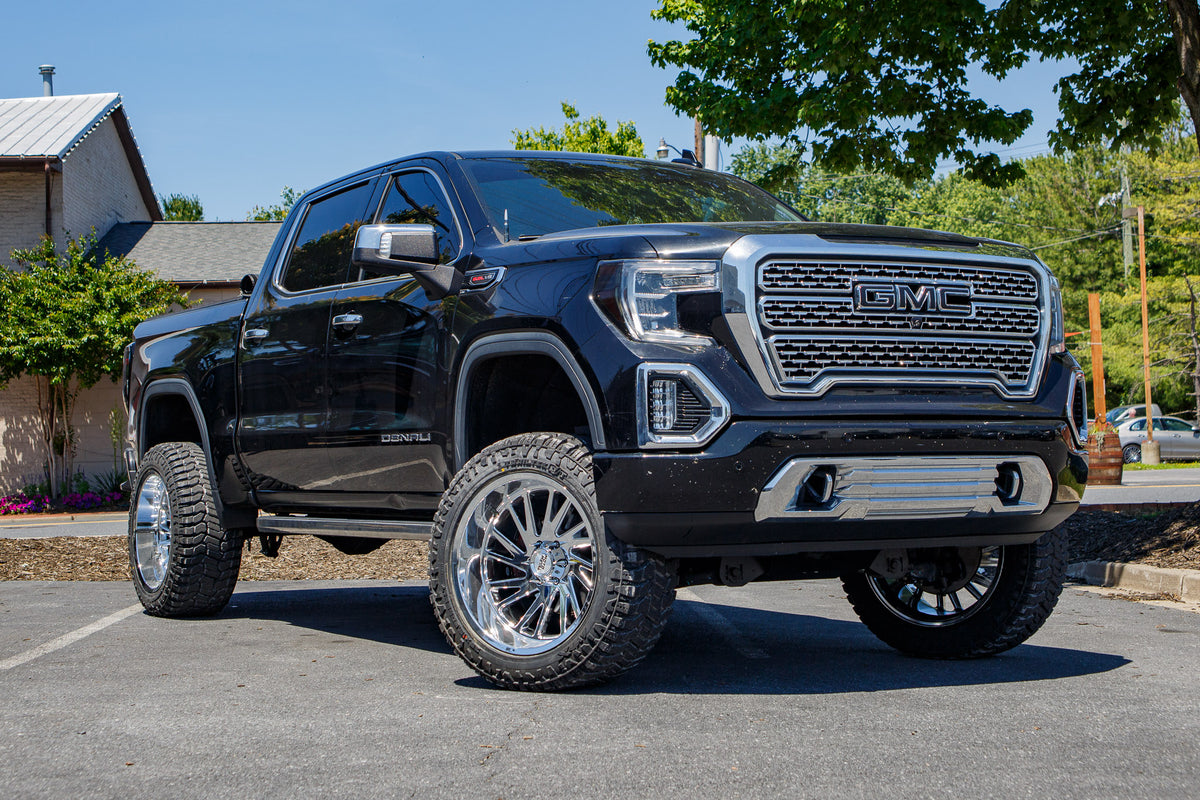 2019 GMC Sierra 1500 Denali with a 6" Rough Country lift kit, 22x12 Moto Metal Combat wheels, and 35" Avix Trailtek R/T tires.