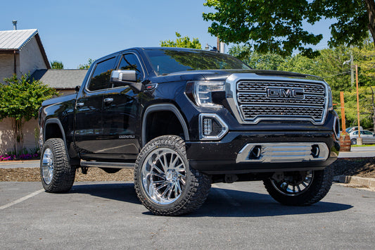 2019 GMC Sierra 1500 Denali with a 6" Rough Country lift kit, 22x12 Moto Metal Combat wheels, and 35" Avix Trailtek R/T tires.