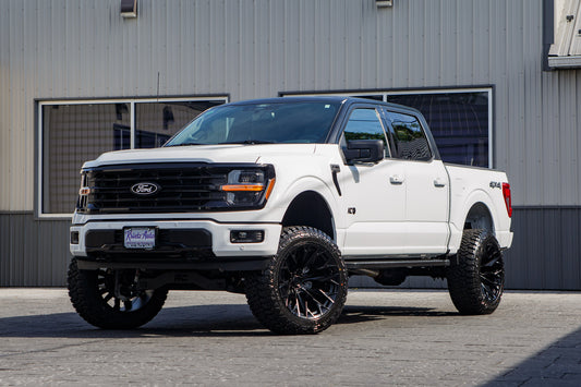 2025 Ford F-150 XLT with a 6" Rough Country lift kit, 22x12 Fuel Flame wheels, and 35" Fury Country Hunter R/T tires.