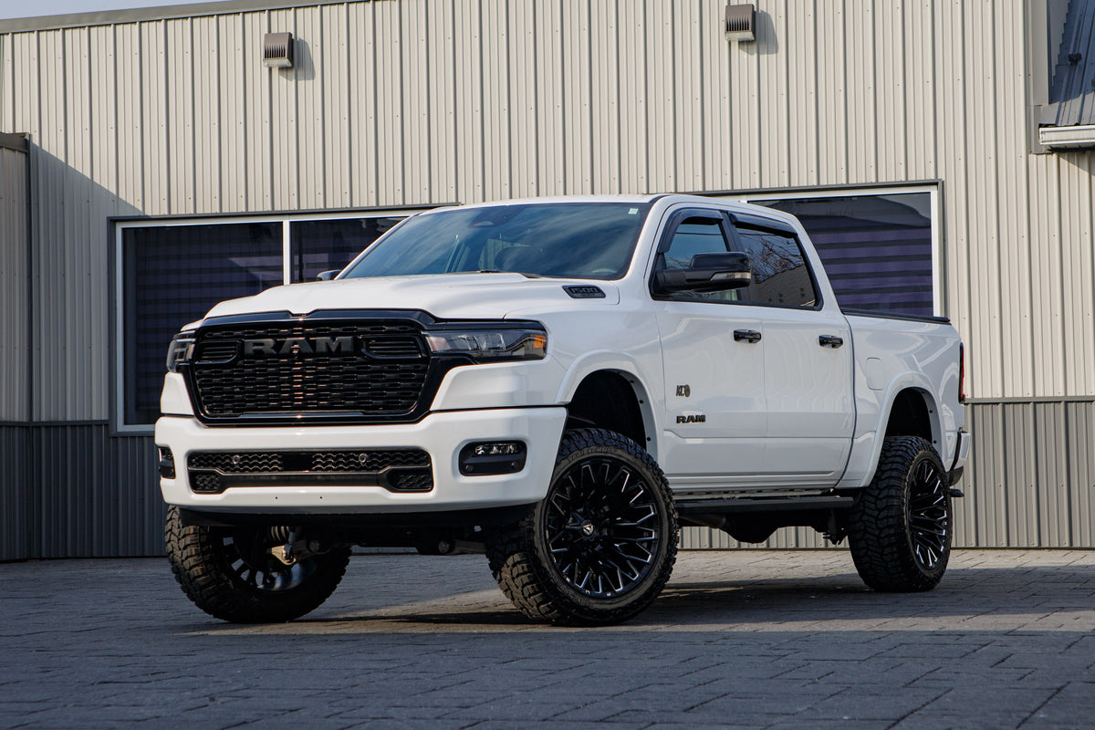 2025 Ram 1500 Big Horn with a 6" Rough Country lift kit, 22x12 Fuel Strike wheels, and 35" Fury Country Hunter R/T tires.
