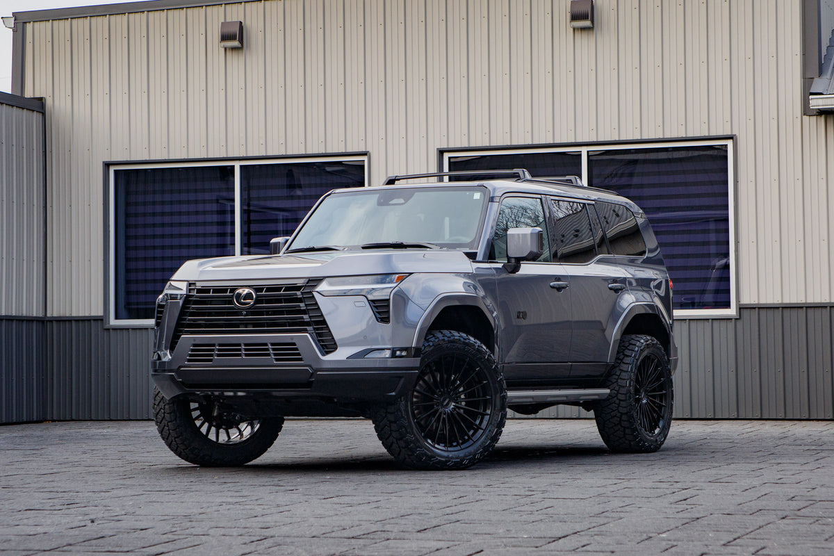 2026 Lexus GX 550 Luxury+ with a 2.5" ReadyLift lift kit, 22x9.5 Vossen HFX4 wheels, and 285/55 Toyo Open Country R/T Trail tires.