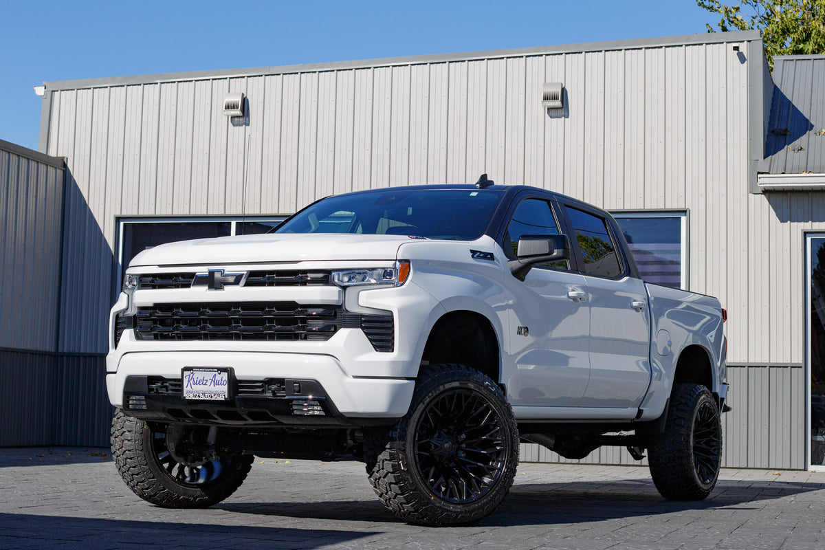 2025 Chevrolet Silverado 1500 RST with a 6" Rough Country lift kit, 22x12 Fuel Strike wheels, and 35" Fury Country Hunter R/T tires.