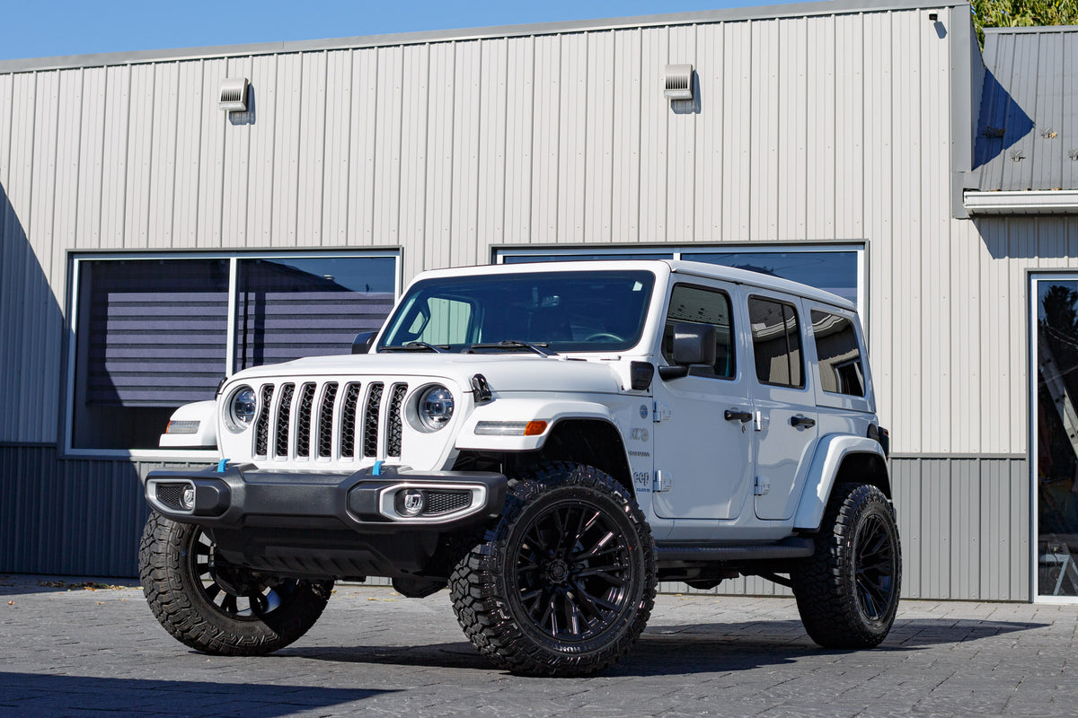 2023 Jeep Wrangler Sahara 4XE with a 2.5" Rough Country lift kit, 22x12 Fuel Rebar wheels, and 35" Avix Trailtek R/T tires.