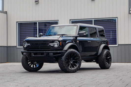 2024 Ford Bronco Wildtrak with a 2.25" Zone lift kit, 22x12 Fuel Flame wheels, and 35" Fury Country Hunter R/T tires.