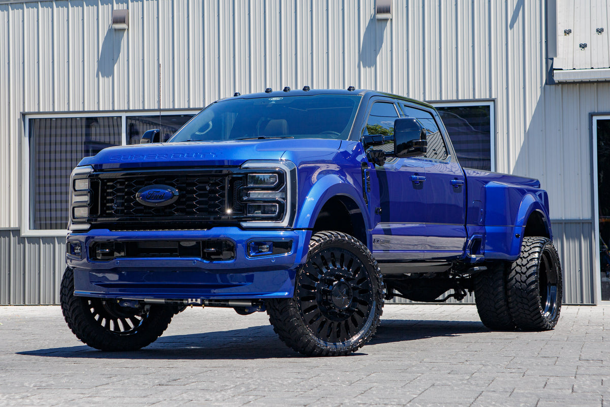 2026 Ford F-450 Super Duty Platinum with a 4" Wicked lift kit, 26x8.25 American Force Massive wheels, and AMP Terrain Attack M/T A tires.