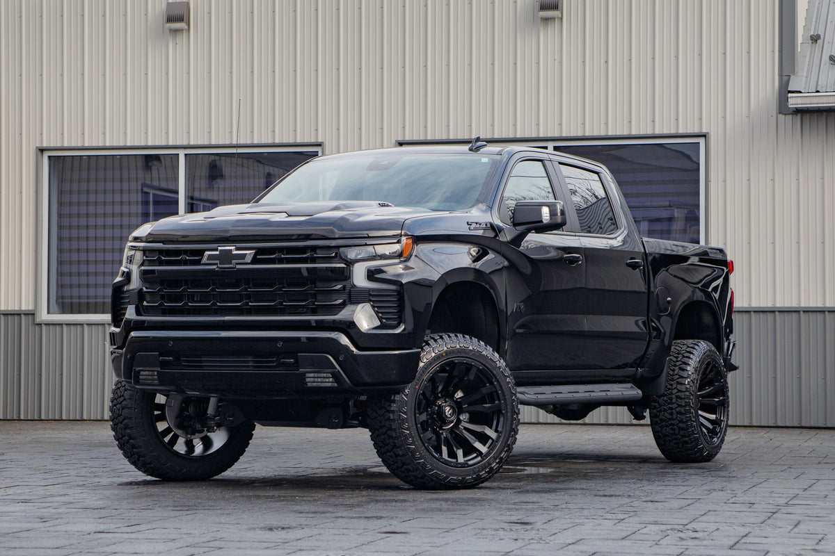 2026 Chevrolet Silverado 1500 LT Trail Boss with a 6" Rough Country lift kit, 22x12 Fuel Blitz wheels, and 35" Fury Country Hunter R/T tires.