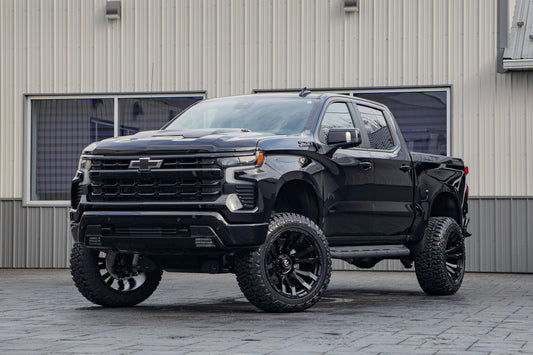 2026 Chevrolet Silverado 1500 LT Trail Boss with a 6" Rough Country lift kit, 22x12 Fuel Blitz wheels, and 35" Fury Country Hunter R/T tires.
