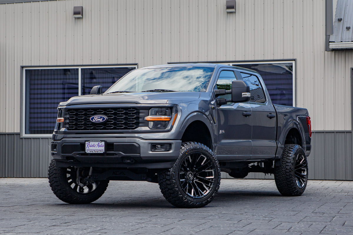 2024 Ford F-150 STX with a 6" Rough Country lift kit, 22x12 Fuel Rebar wheels, and 35" Fury Country Hunter R/T tires.