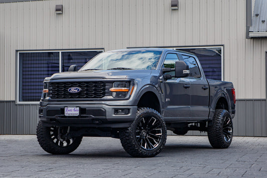 2024 Ford F-150 STX with a 6" Rough Country lift kit, 22x12 Fuel Rebar wheels, and 35" Fury Country Hunter R/T tires.