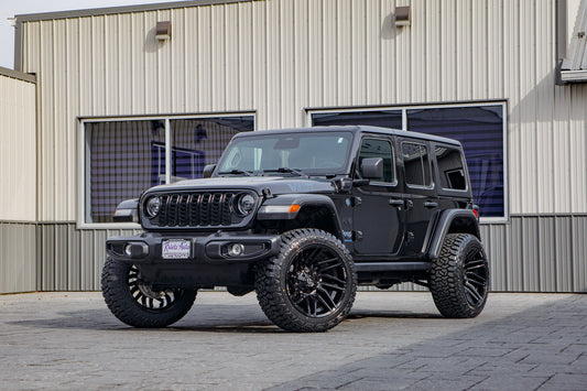 2025 Jeep Wrangler Sport S 4XE with a 2.5" Rough Country lift kit, 22x12 Fuel Typhoon wheels, and 35" Fury Country Hunter R/T tires.