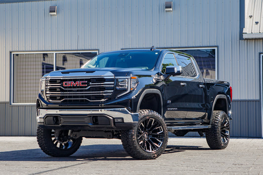 2026 GMC Sierra 1500 SLT with a 6" Rough Country lift kit, 22x12 Fuel Rebar wheels, and 35" Fury Country Hunter R/T tires.