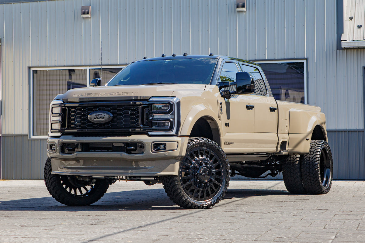 2026 Ford F-450 Super Duty Platinum with a 4" Wicked lift kit, 26x8.25 American Force Reactor wheels, and 37" AMP Terrain Attack M/T A tires.