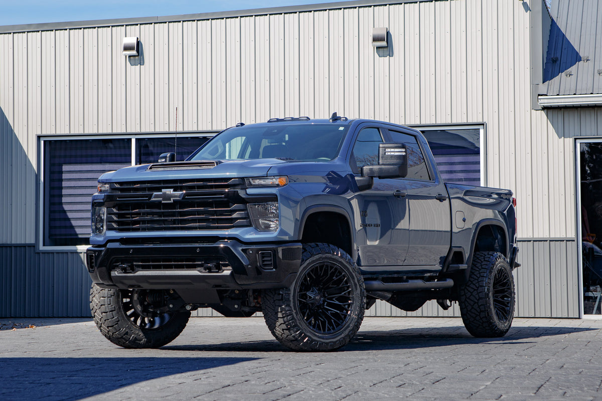 2026 Chevrolet Silverado 2500 Custom with a 6" BDS lift kit, 22x12 Fuel Strike wheels, and 37" Nitto Ridge Grappler tires.