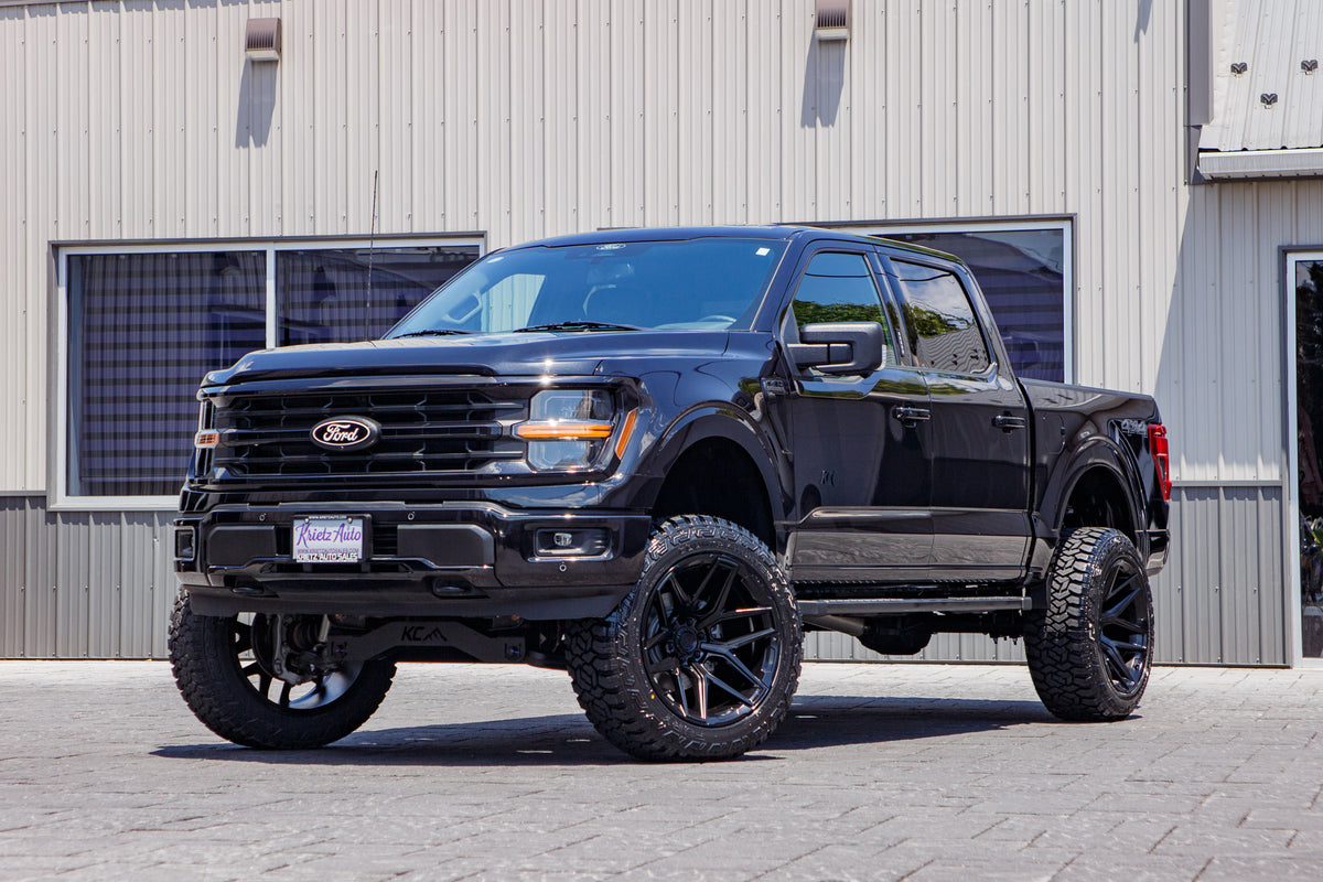 2024 Ford F-150 XLT with a 6" Rough Country lift kit, 22x12 Fuel Flux wheels, and 35" Fury Country Hunter R/T tires.