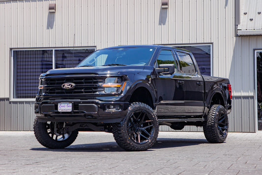 2024 Ford F-150 XLT with a 6" Rough Country lift kit, 22x12 Fuel Flux wheels, and 35" Fury Country Hunter R/T tires.