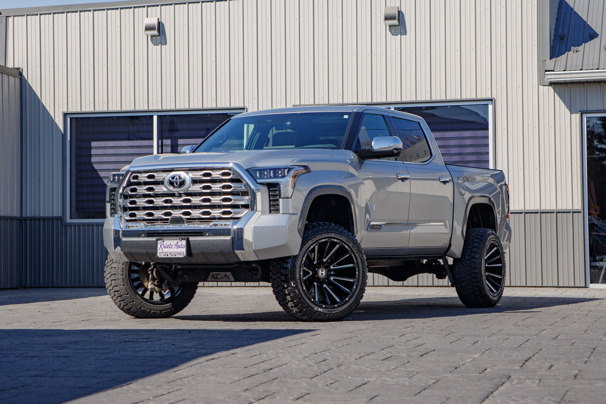 2024 Toyota Tundra Platinum with a 6" Rough Country lift kit, 22x12 Hostile H123 wheels, and 35" Fury Country Hunter R/T tires.