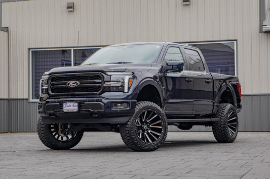 2025 Ford F-150 Lariat with a 6" Rough Country lift kit, 22x12 Hostile H123 wheels, and 35" Fury Country Hunter R/T tires.