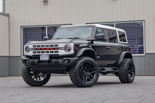 2025 Ford Bronco Heritage Edition with a 2.5" Rough Country lift kit, 22x12 Fuel Flux wheels, and 35" Avix Trailtek R/T tires.