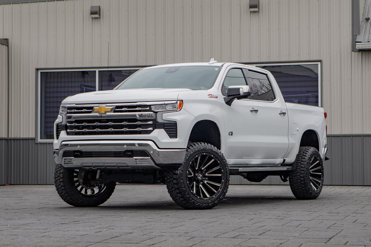 2025 Chevrolet Silverado 1500 LTZ with a 6" Rough Country lift kit, 22x12 Hostile H123 wheels, and 35" Fury Country Hunter R/T tires.