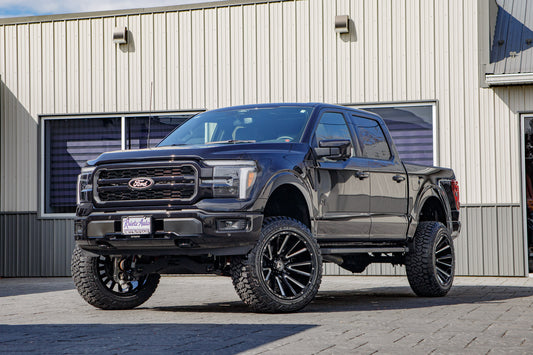 2025 Ford F-150 Lariat with a 6" Rough Country lift kit, 22x12 Hostile H123 wheels, and 35" Fury Country Hunter R/T tires.