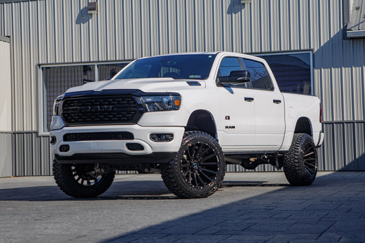 2023 Ram 1500 Lone Star with a 6" Rough Country lift kit, 22x12 Hostile H123 wheels, and 35" Fury Country Hunter R/T tires.