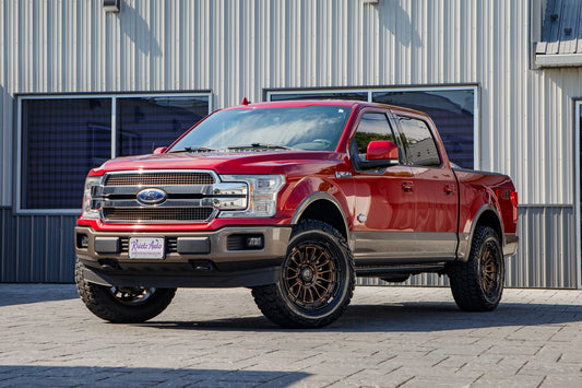 2018 Ford F-150 King Ranch with an Eibach Leveling Kit, 20x9 Black Rhino Rival wheels, and 295/60 Mickey Thompson Baja Boss A/T tires.