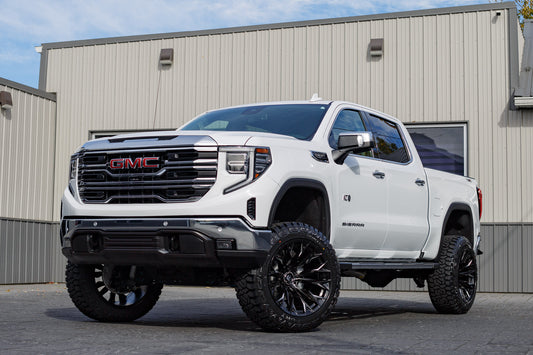 2025 GMC Sierra 1500 SLT with a 6" Rough Country lift kit, 22x12 Fuel Flame wheels, and 35" Fury Country Hunter R/T tires.