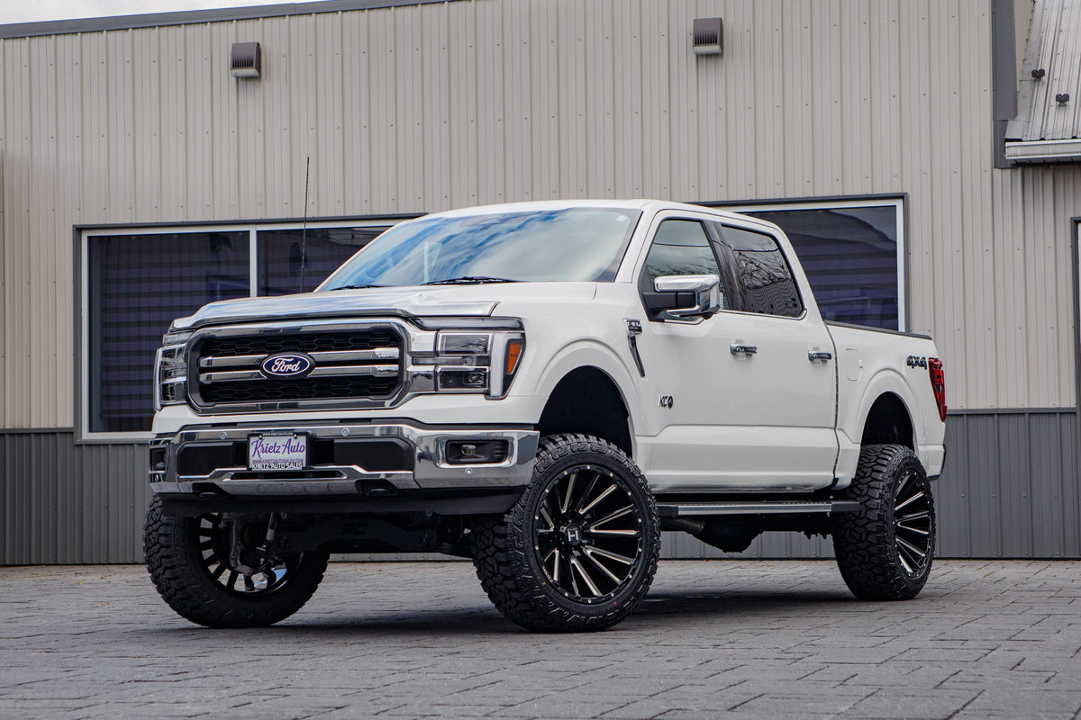 2025 Ford F-150 Lariat with a 6" Rough Country lift kit, 22x12 Hostile H123 wheels, and 35" Fury Country Hunter R/T tires.