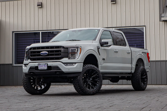 2023 Ford F-150 XLT with a 6" Rough Country lift kit, 22x12 Fuel Flame wheels, and 35" Fury Country Hunter R/T tires.