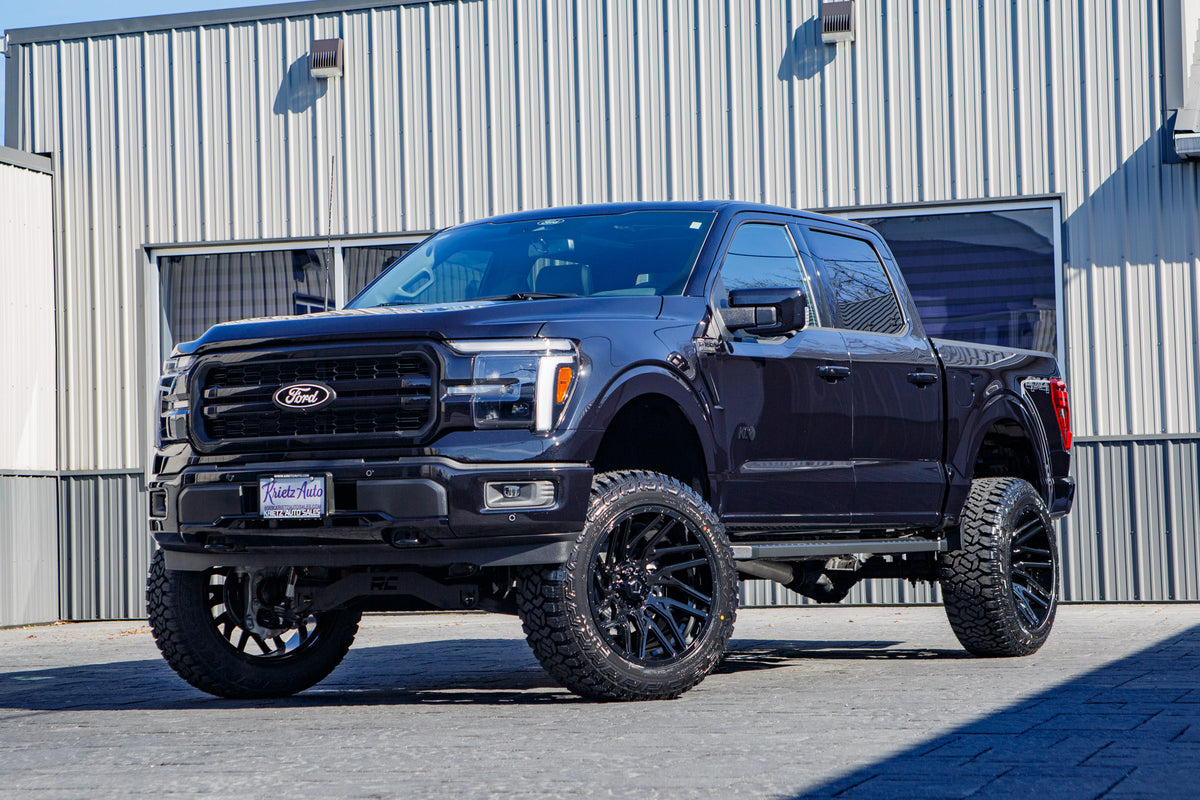2025 Ford F-150 Lariat with a 6" Rough Country lift kit, 22x12 TIS 554B wheels, and 35" Fury Country Hunter R/T tires.