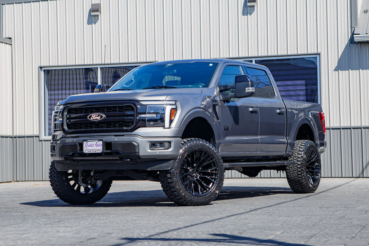 2025 Ford F-150 Lariat with a 6" Rough Country lift kit, 22x12 Fuel Rebar wheels, and 35" Fury Country Hunter R/T tires.