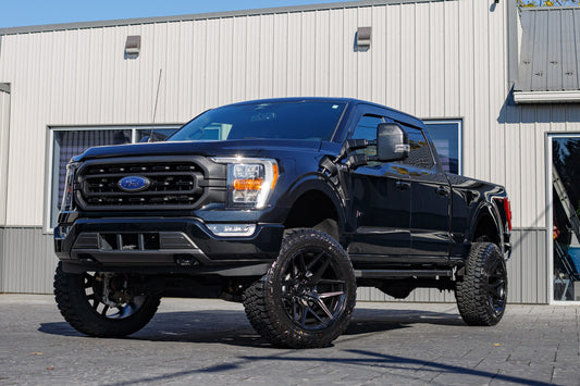 2022 Ford F-150 XLT with a 6" Rough Country lift kit, 22x12 Fuel Flux wheels, and 35" Fury Country Hunter R/T tires.