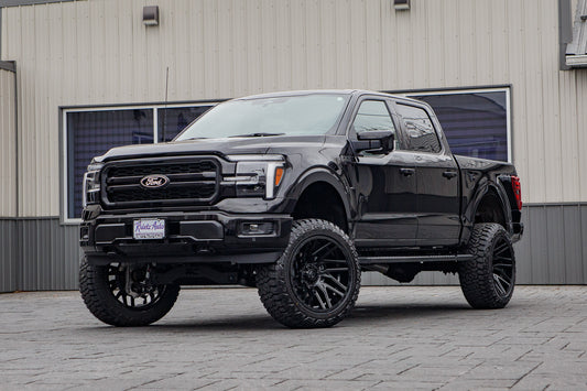 2025 Ford F-150 Lariat with a 6" Rough Country lift kit, 22x12 TIS 554B wheels, and 35" Fury Country Hunter R/T tires.