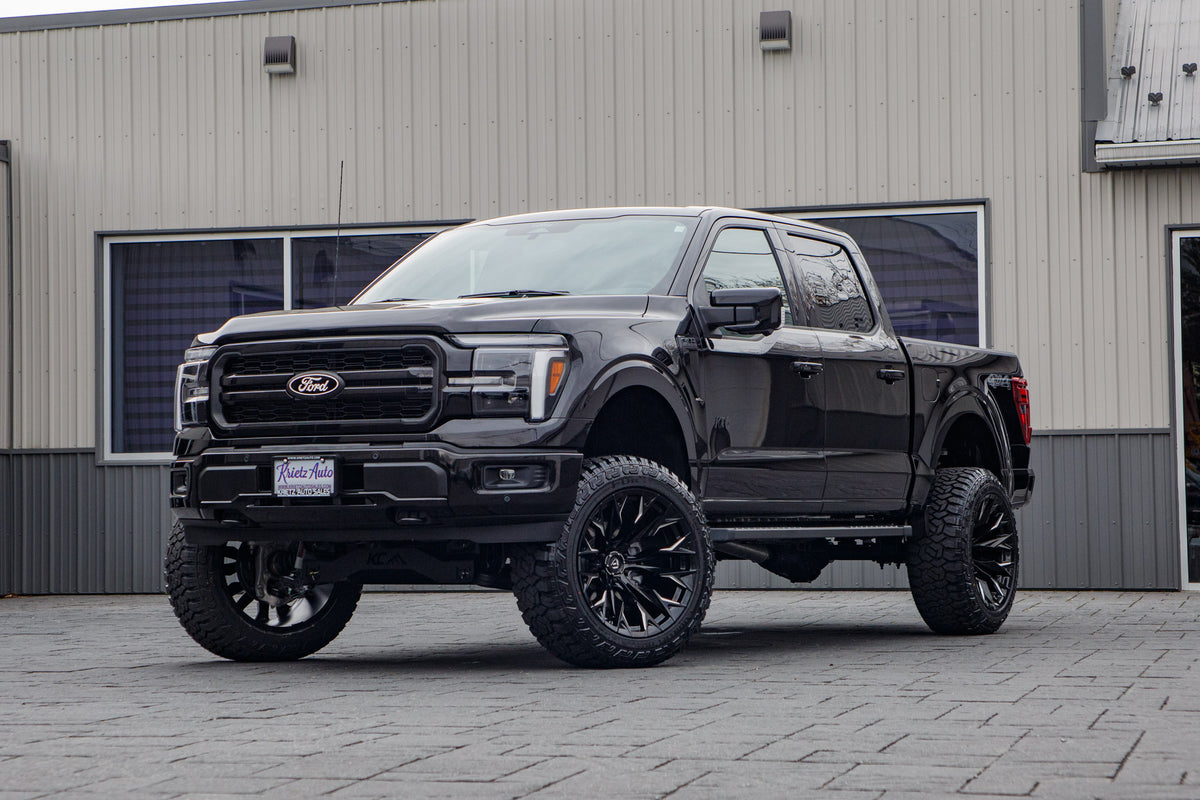 2025 Ford F-150 Lariat with a 6" Rough Country lift kit, 22x12 Fuel Flame wheels, and 35" Fury Country Hunter R/T tires.