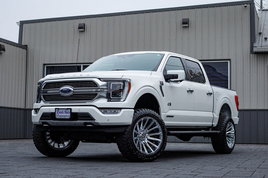 2023 Ford F-150 Limited with a 6" ReadyLift lift kit, 22x12 Hostile Typhoon wheels, and 35" Fury Country Hunter R/T tires.