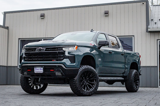2025 Chevrolet Silverado 1500 LT Trail Boss with a 6" Rough Country lift kit, 22x12 Fuel Rebar wheels, and 35" Fury Country Hunter R/T tires.