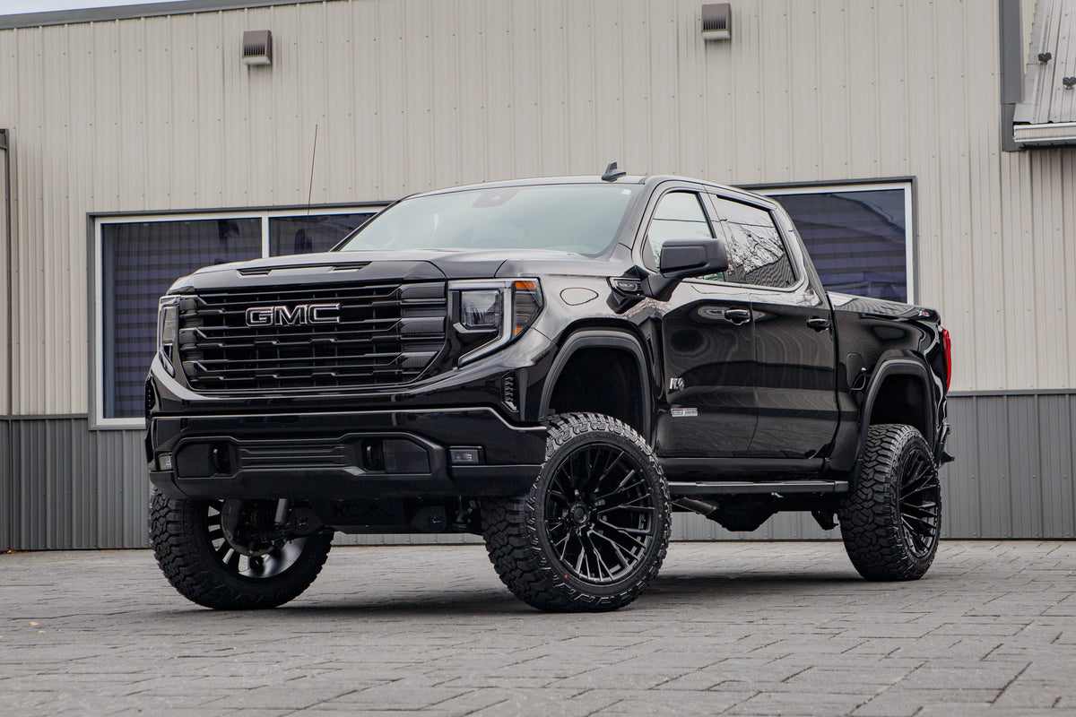 2026 GMC Sierra 1500 Elevation with a 6" Rough Country lift kit, 22x12 Fuel Rebar wheels, and 35" Fury Country Hunter R/T tires.