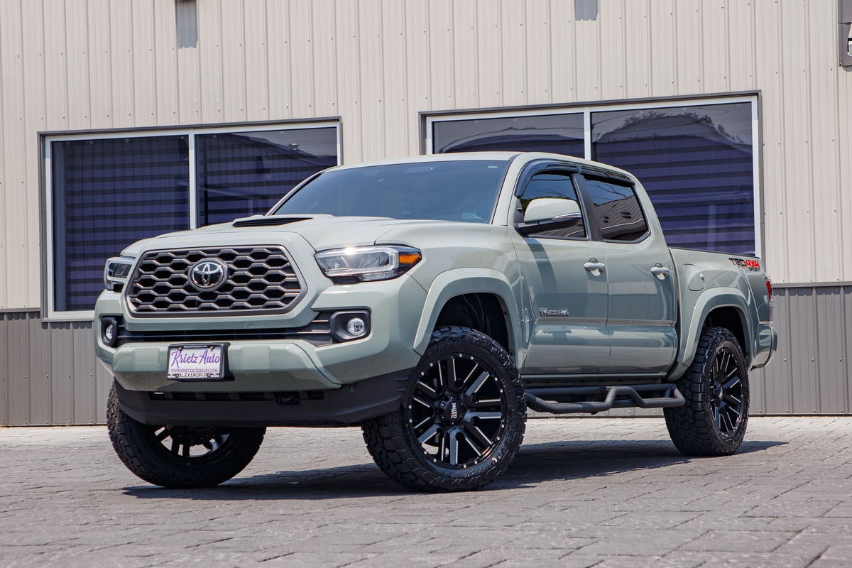 2023 Toyota Tacoma SR5 with a 2" Rough Country leveling kit, 20x9 Moto Metal Razor wheels, and 275/55 Toyo Open Country A/T III tires.