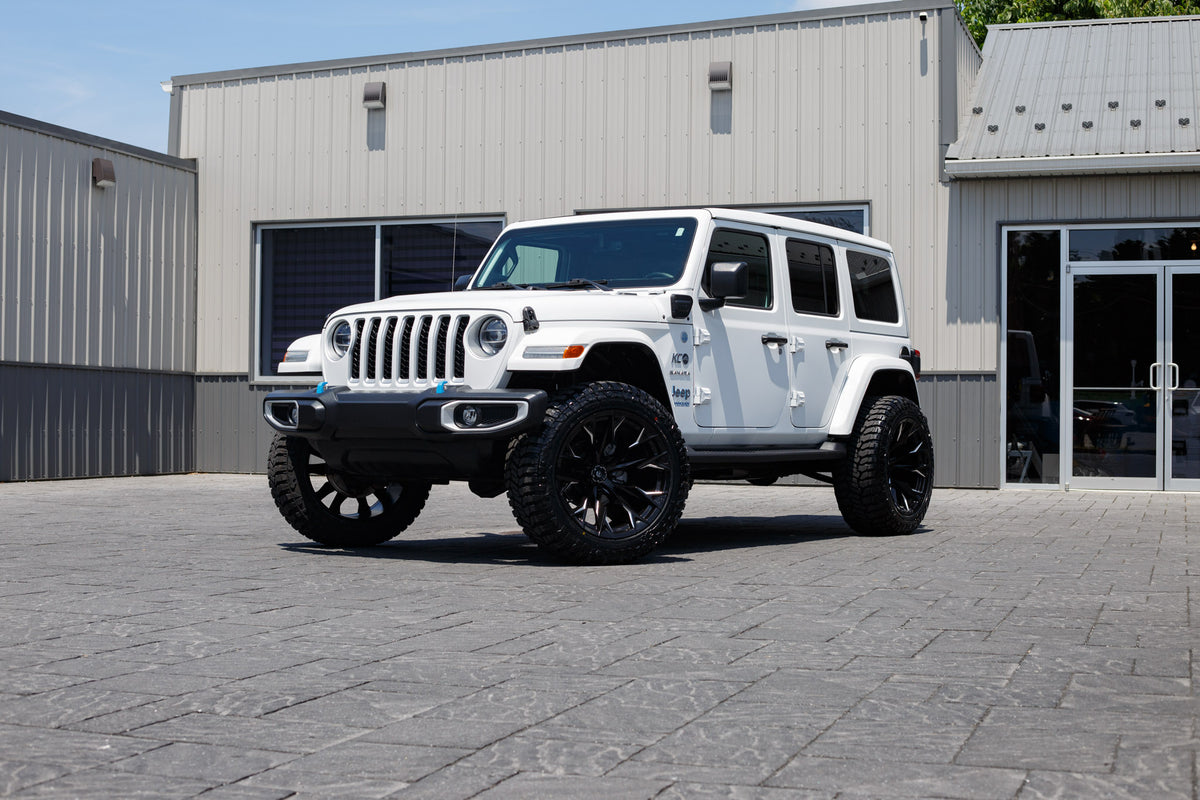2022 Jeep Wrangler Unlimited Sahara 4XE with a 2.5" Rough Country lift kit, 22x12 Fuel Flame wheels, and 35" Avix Trailtek R/T tires.