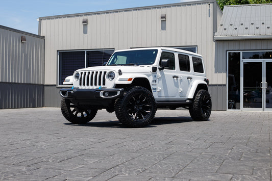 2022 Jeep Wrangler Unlimited Sahara 4XE with a 2.5" Rough Country lift kit, 22x12 Fuel Flame wheels, and 35" Avix Trailtek R/T tires.